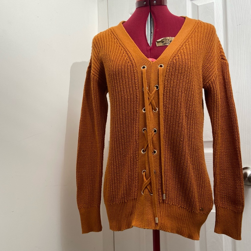 Guess women mustard yellow long sleeves lace front knitted sweater.Size XS. Used